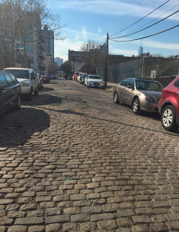 Cobblestoned Vinegar Hill block is a rocky road