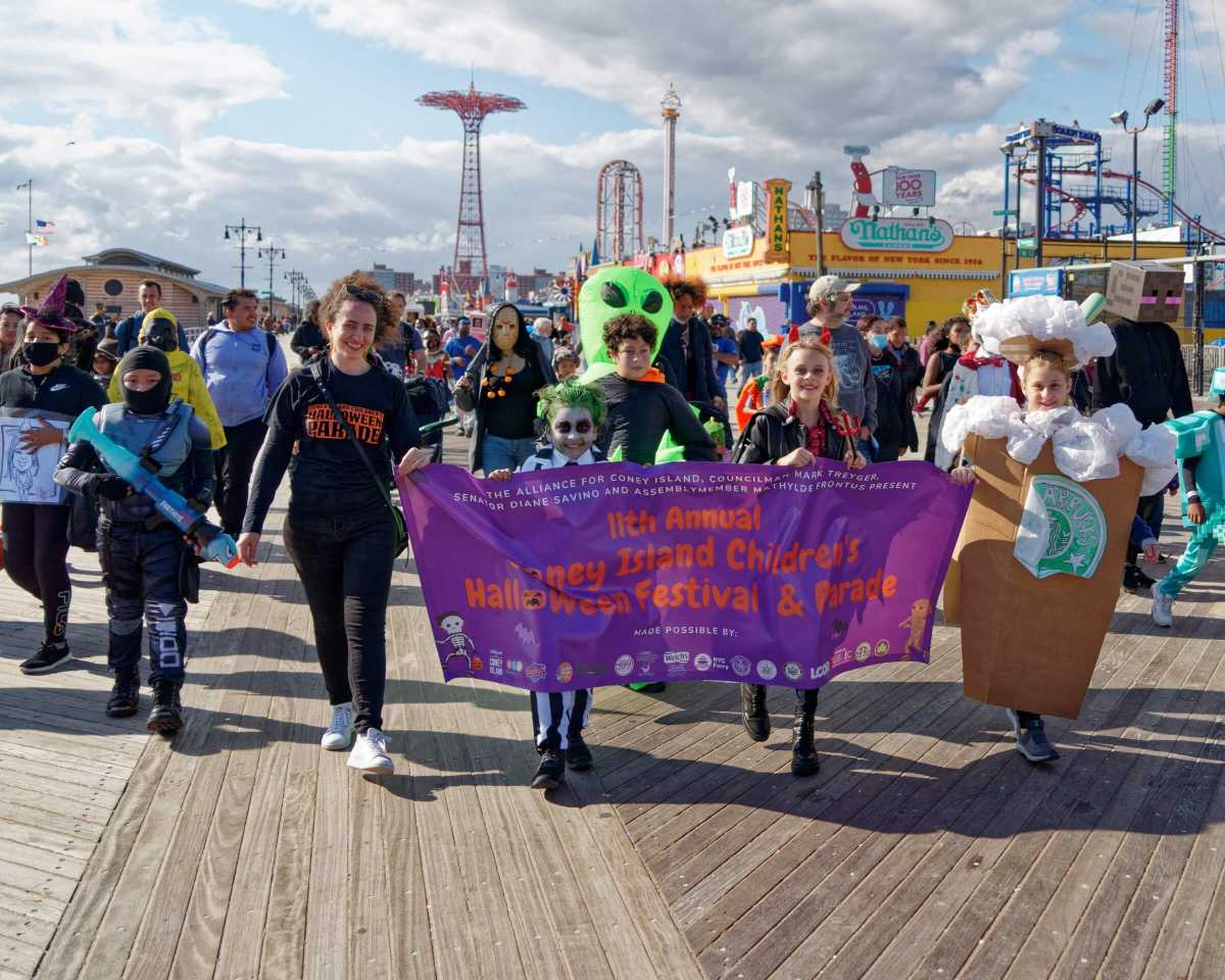 the coney island halloween parade on the boardwalk