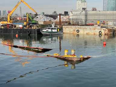 a large barge sunk in newtown creek near Greenpoint