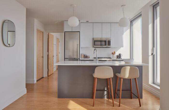 picture of kitchen counter and stools at one south first