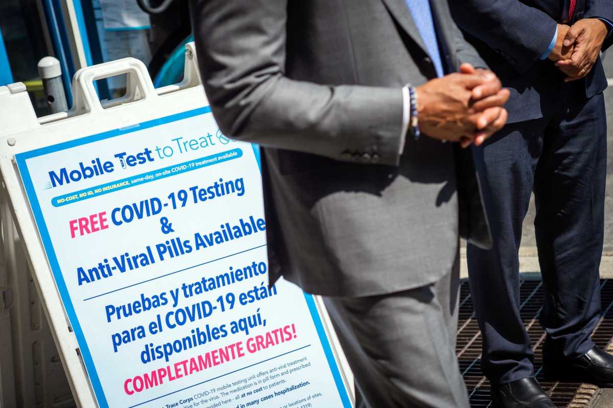 eric adams with sign for mobile covid testing