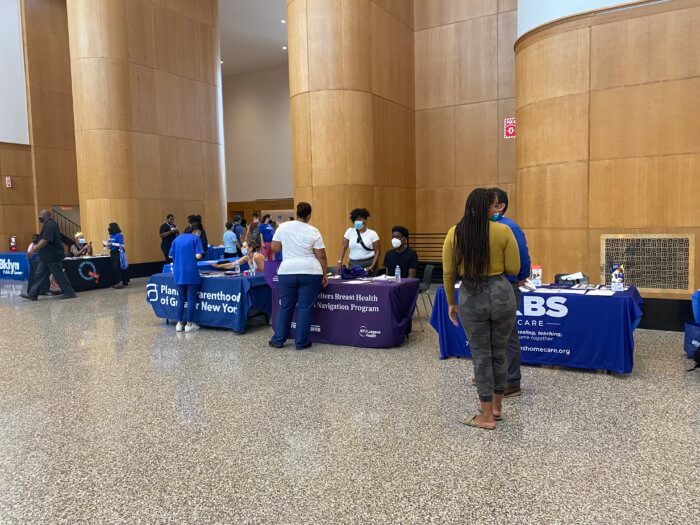 Participants passed out informative packets at their booths at brooklyn public library