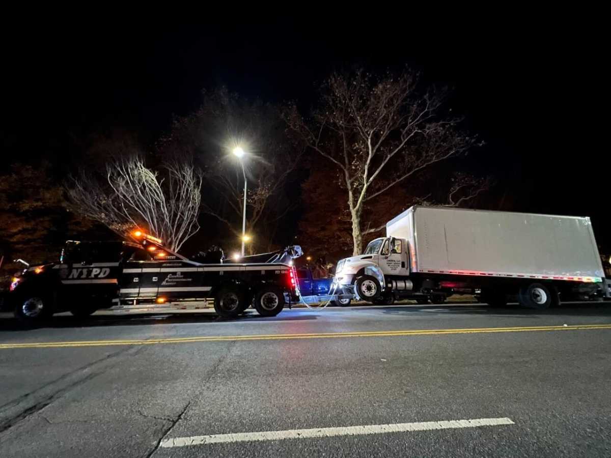illegally parked tractor-trailer getting booted