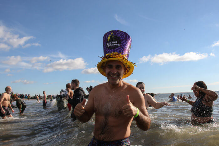 man in NYE hat at polar plunge