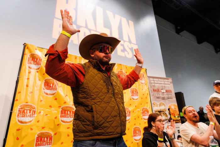 man winning bagel-eating competition 