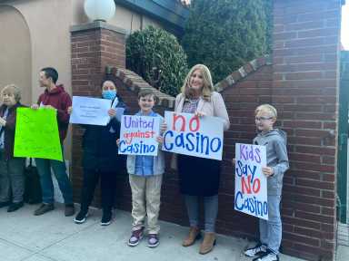 A crowd of Coney Islander's gather outside a meeting hosted by CB13 protesting a potential casino in the area.