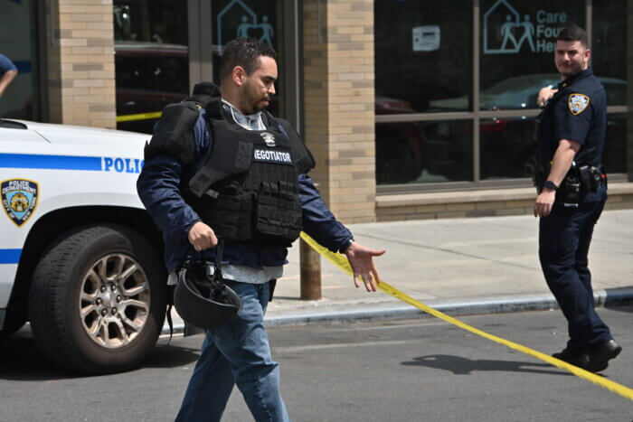 Police set up a wide perimeter around the afternoon crime scene in Brownsville.