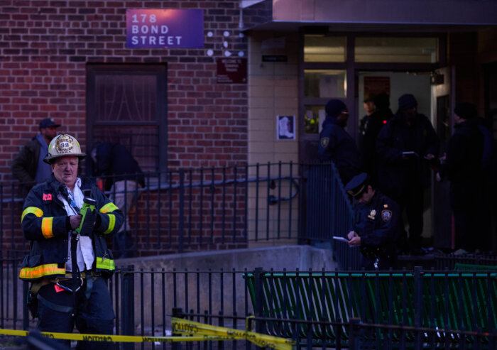 firefighters outside nycha building fire