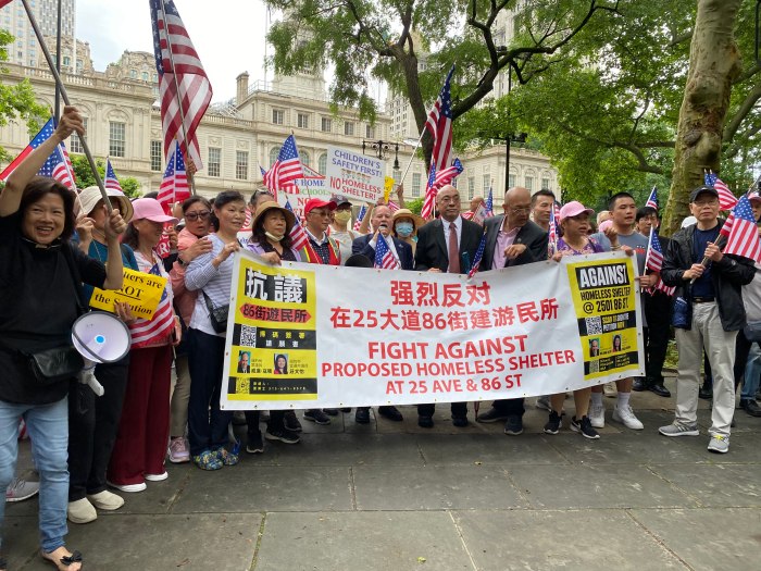 Hundreds waited outside the gates of City Hall during the morning press conference, Assembly member Colton joined them for a march around the park afterward