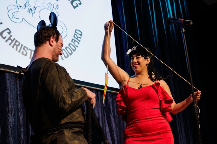 Woman with pizza rat at Miss Subways 2024