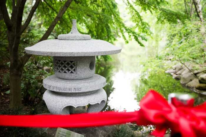 The peace lantern features a message of hope inscribed in capital letters: “CASTING THE LIGHT OF EVERLASTING PEACE.”