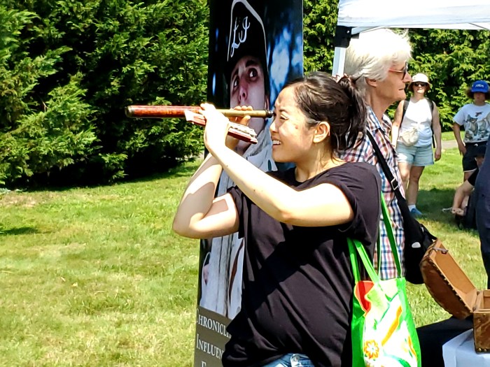 The event was full of hands-on learning experiences. One attendee checks out a gun site with dated trinkets.