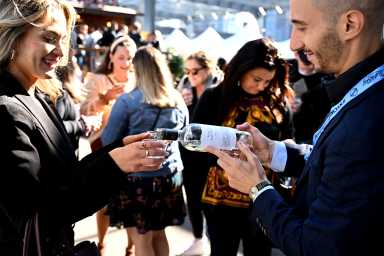 people pouring wine at food network new york city wine and food festival