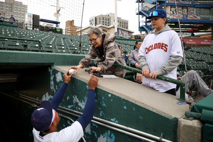 cyclones player signign ball