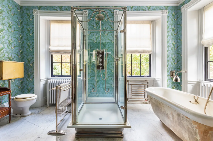 bathroom in moonstruck home with shower and tub