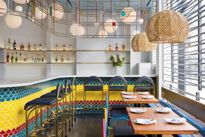 fish cheeks interior with colorful scaly wall and chairs