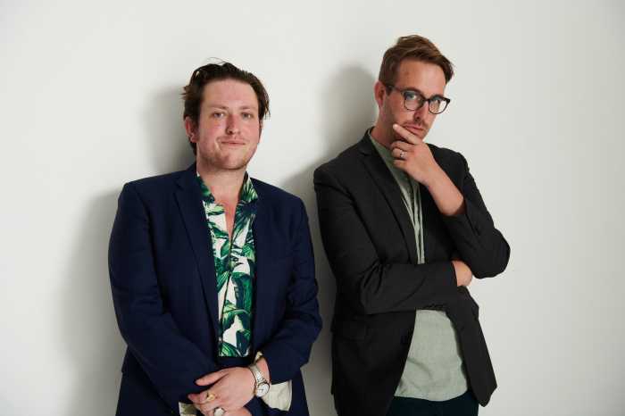 two men standing on white background
